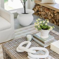 Square Wicker Coffee Table With Flowers and Books 