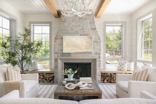 Three-Season Contemporary Neutral Porch With Stone Fireplace | HGTV