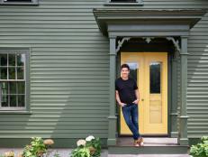 Jonathan Knight on the front porch of the newly renovated Knight farmhouse, as seen on Farmhouse Fixer.