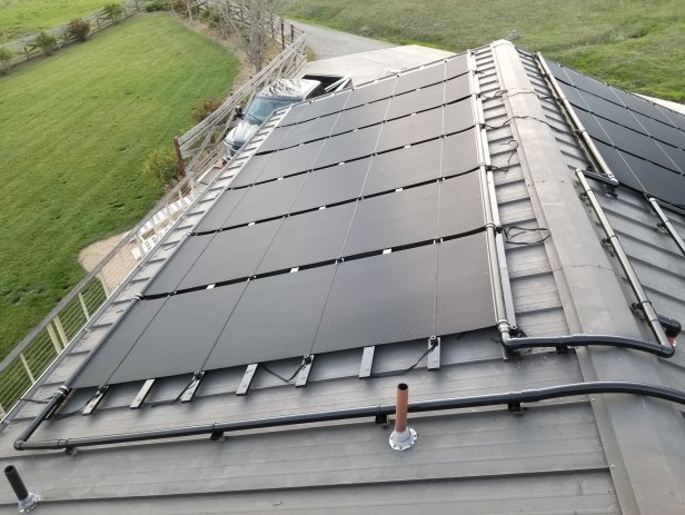 Solar Pool Heating Collectors on a Metal Roof