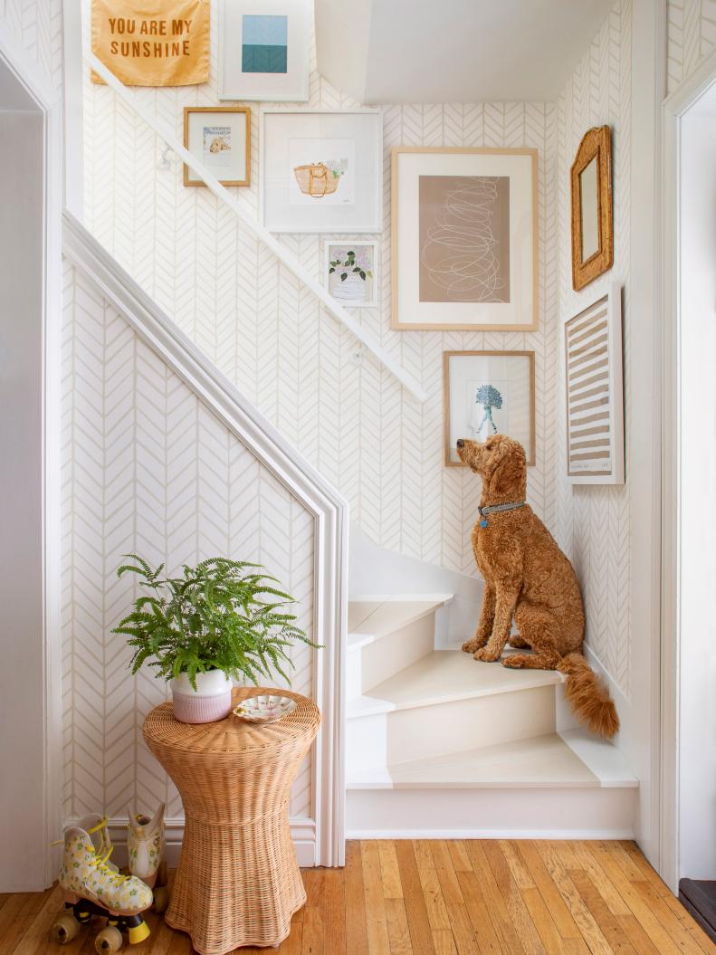 Wallpapered Stairwell With a Gallery Wall