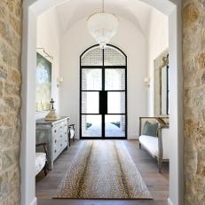 Traditional Foyer With Brown Rug
