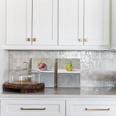 White Kitchen Cabinets and Pear Art