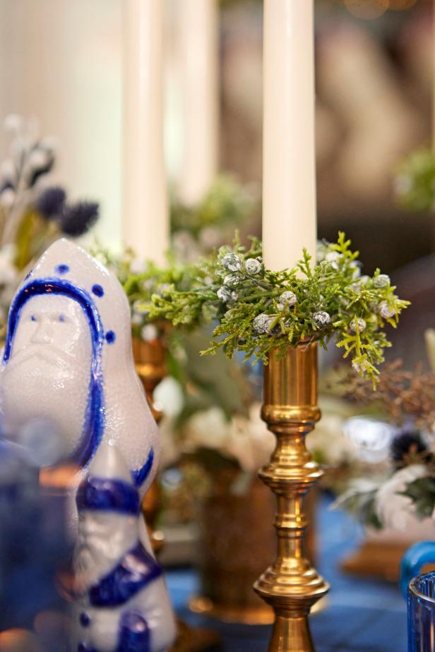 In just a few steps, you can upcycle plain napkin rings and a bit of faux greenery into mini candle rings that are an easy way to festive up taper candles.