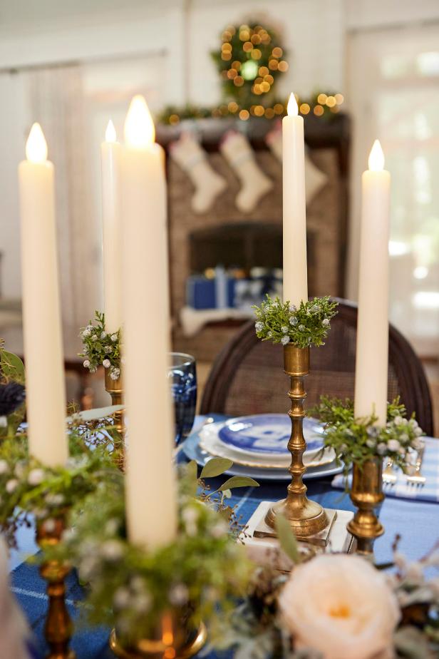 In just a few steps, you can upcycle plain napkin rings and a bit of faux greenery into mini candle rings that are an easy way to festive up taper candles.