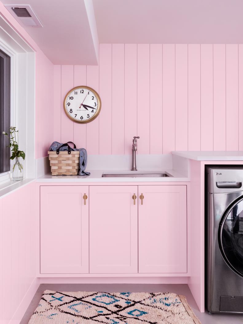 Pale Pink Laundry Room With a Sink