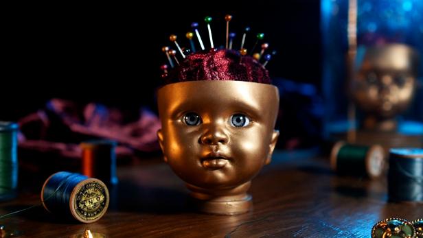 Gold Babydoll Head With Velvet Rice Ball as Pincushion With Pins