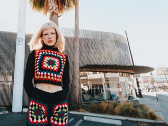 Liv Huffman wears her Avery Vest consisting of crochet granny squares