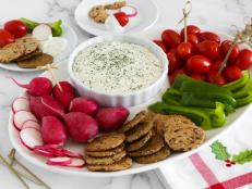 Nonfat Greek yogurt is the secret ingredient for making this veggie dip light in fat and calories. Garlic and herbs give it bold, rich flavor. It takes just minutes to whisk together and can be made a day ahead. Serve with an assortment of your favorite crudités. One dip and you’ll be hooked!