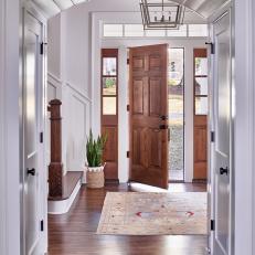 Transitional Foyer With Arched Doorway