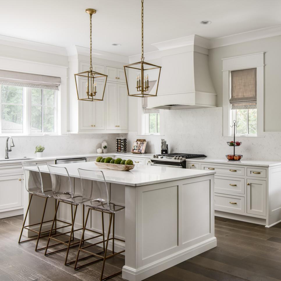 Transitional White Kitchen With Brass Pendants | HGTV