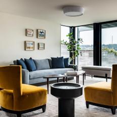 Contemporary Waterfront Living Room With Yellow Chairs