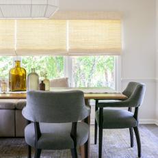 Neutral Transitional Dining Room With Glass Bottles