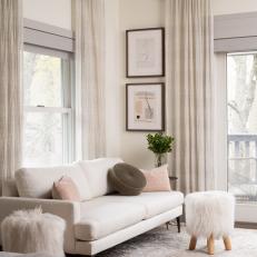 Transitional Sitting Area With White Fur Stools