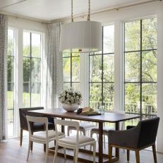 Neutral Transitional Dining Room With Garden View