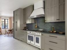 Galley Kitchen With Olive Green Cabinets and White Appliances