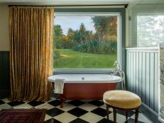 Eclectic Bathroom With Red Clawfoot Tub