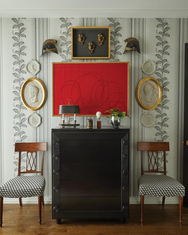 This traditional entrance is updated with modern art in red.