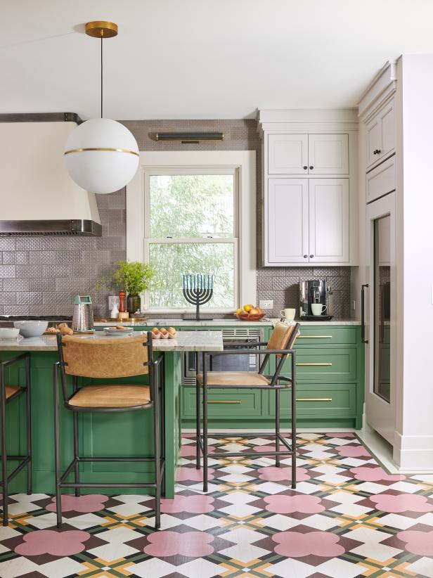 Colorful Kitchen With Green Cabinets and a Painted Floor