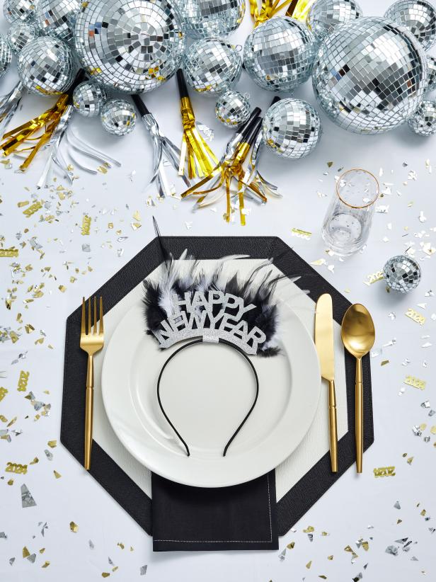Black, White and Metallic New Year's Eve Table With Disco Balls