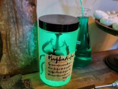 Brighten your Halloween decorations with these neon-green, glowing jars that look like they came straight out of a mad scientist's laboratory.