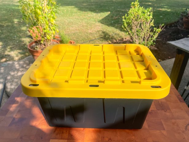The first step in building a DIY hydroponic garden is to choose an opaque plastic container around five gallons with a lid.