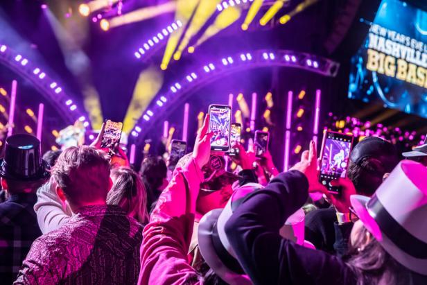 Revelers hold camera phones at Nashville's Big Bash, a live New Year's Eve celebration on the Jack Daniels stage.