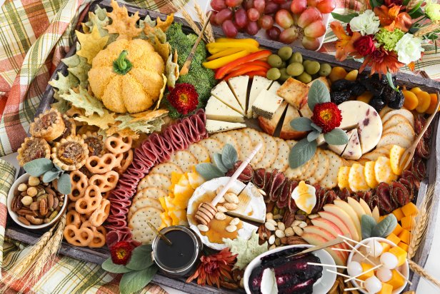 This delectable assortment includes all the classics you’d expect on a party board but also includes fall seasonal favorites in eye-catching autumn colors. 