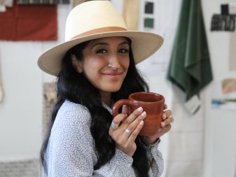 Veronica drinks coffee at her office in DTLA