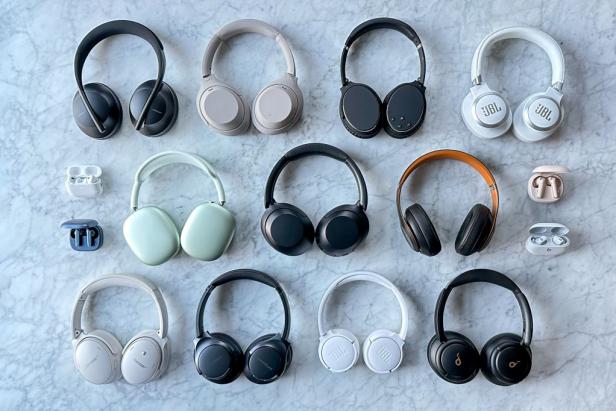 15 Headphones and Earbuds in Cases on Table Top 