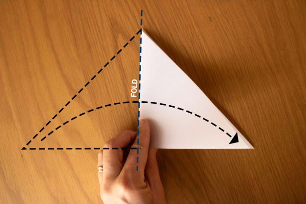 Fold the paper into a smaller triangle.