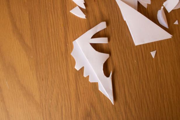 Trim the edges of your paper snowflake to create a one-of-a-kind design.