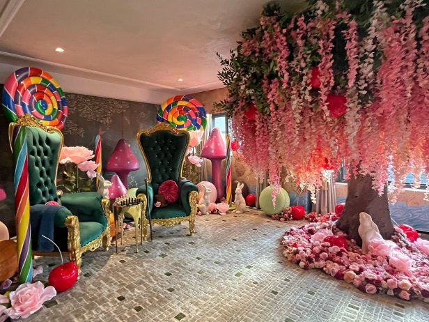 Hotel Suite With a Faux Tree and Whimsical Candy Display