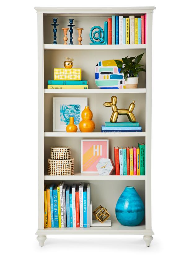 Neatly Organized Shelves With Decor and Books