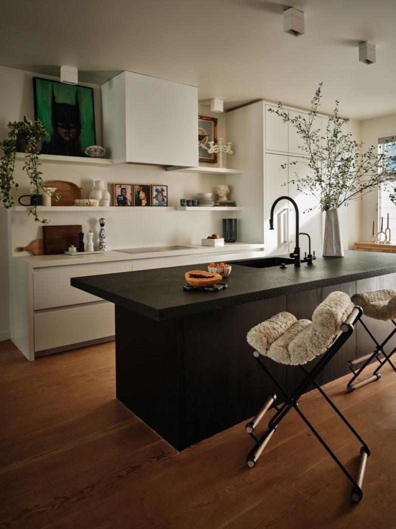 A photo of a California-style kitchen with black granite countertop.