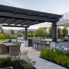Outdoor Dining Area With Gray Pergola