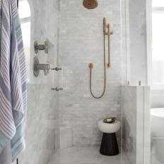 Gray Walk In Shower With Black and White Stool