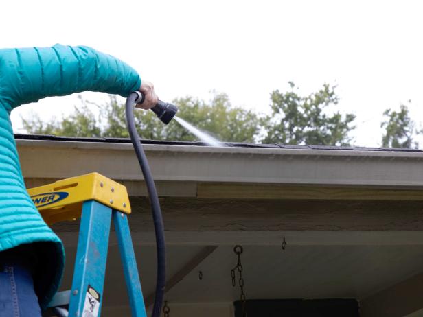 cleaning gutters: flush them with water