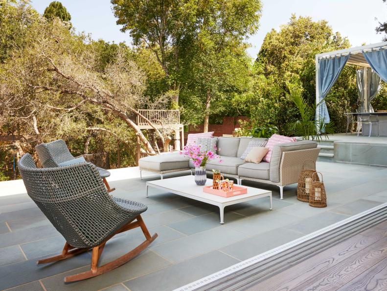 This cool patio from HGTV Magazine features modern outdoor furniture and great views.