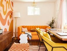 Orange and White Living Area With Orange Sofa, Gold Floor Lamp