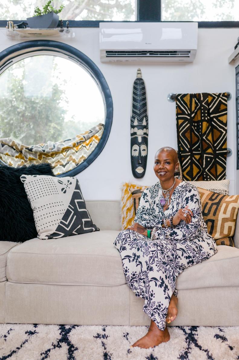 Jewel Pearson poses on sofa in her home