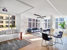 Contemporary Open-Plan White Apartment With City Views and Blue Accents 