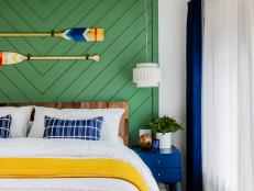 Coastal Bedroom With a Green Accent Wall