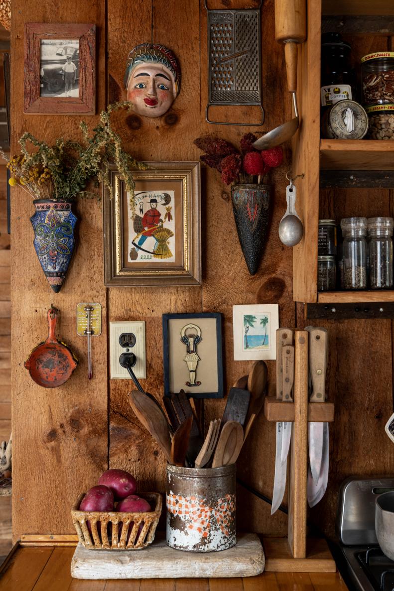Small Kitchen in Wood Cabin, Art on Fridge, Open Shelving