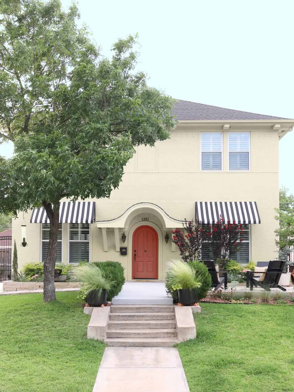 Beige Brick Home With Awnings HGTV