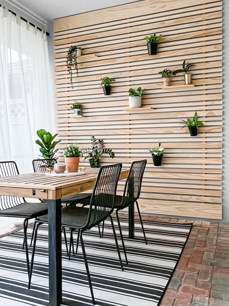 Outdoor Dining Area With Natural Wood Accent Wall HGTV