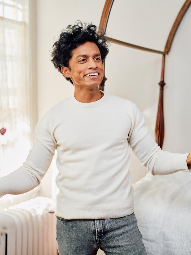 Rajiv Surendra Smiling In a White Wool Sweater