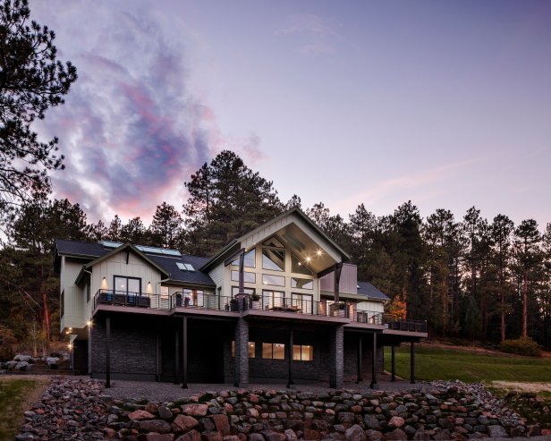 Exterior photography of 2023 HGTV Dream Home in Morrison, Colorado. Photography of Belgard Hardscape products and Trex composite decking and railing.