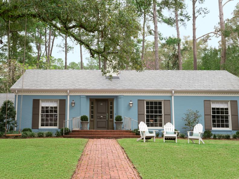 Light Blue Ranch Home With a Soft Brown Front Door