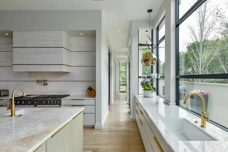 White Kitchen With Gold Faucets